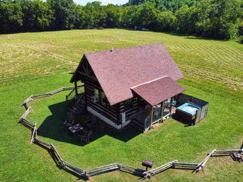 an aerial view of a house with a roof at Creekwalk Inn Bed and Breakfast with Cabins in Cosby