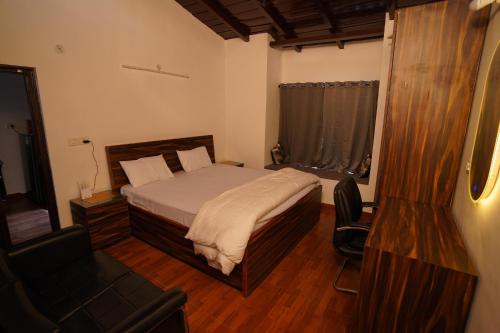 Postel nebo postele na pokoji v ubytování Himalayanblues cottages&stays