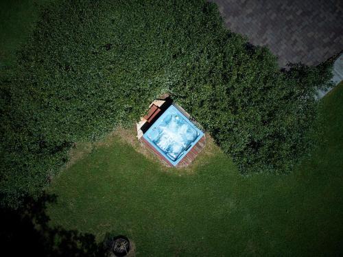 an overhead view of a swimming pool in the grass at Creekwalk Inn Bed and Breakfast with Cabins in Cosby