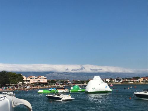 a group of boats in a body of water at H&S Mobile Home in Privlaka