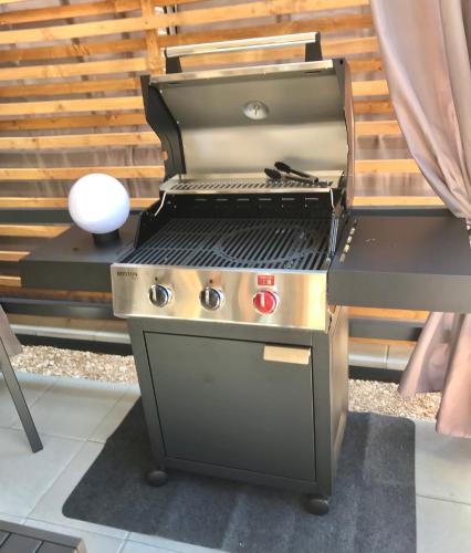 a barbecue grill sitting on top of a patio at H&S Mobile Home in Privlaka