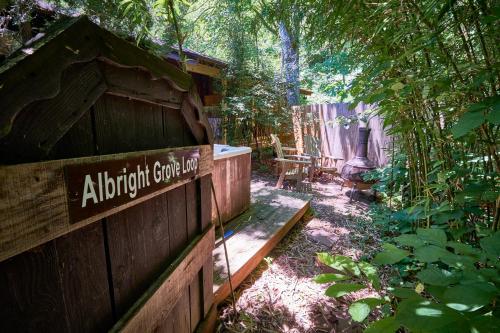 a garden with a wooden fence and a bench at Creekwalk Inn Bed and Breakfast with Cabins in Cosby