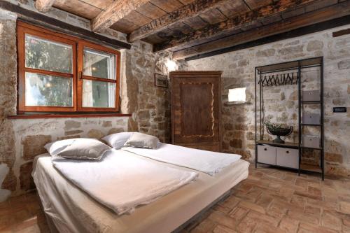 Postel nebo postele na pokoji v ubytování Casa-Pietra Porec