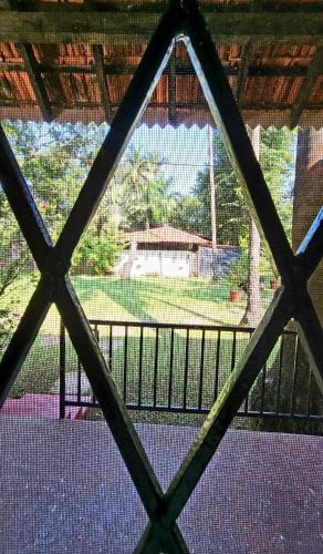 a view from a window of a house with a yard at Garden Villa in Vagator
