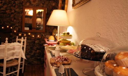 a buffet with a cake on a table in a room at Chorros del Río Mundo in Riópar
