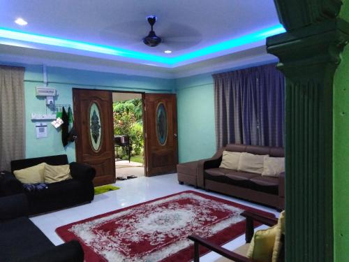 Χώρος καθιστικού στο Adeeva Homestay Langkawi