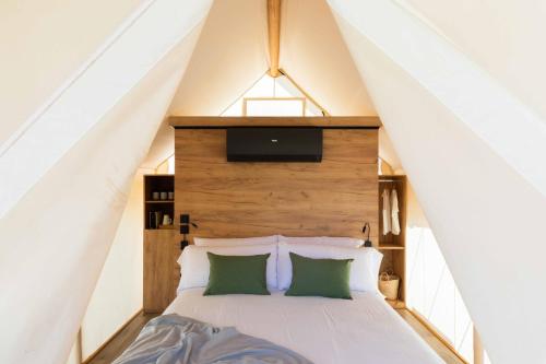 a bedroom with a bed in a tent at wecamp Cabo de Gata in Las Negras