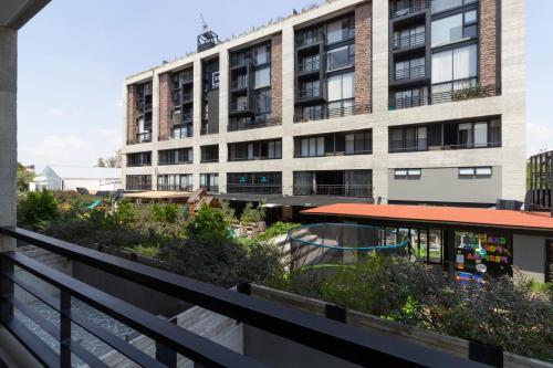 a view of a building from a balcony at El Doce by HomiRent in Laborcillas