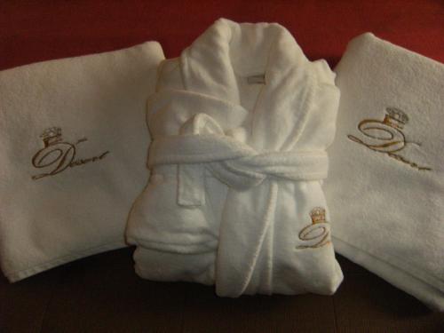 a pair of towels with rings on them at Palais Du Desert Hotel & Spa in Erfoud