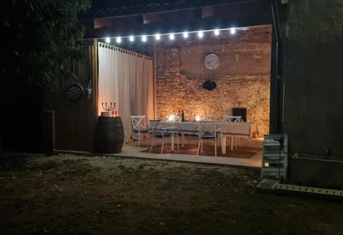 a dining room with a table and chairs at night at B&B Karin - Rooms & Breakfast in Udine