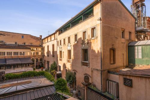 a view of an old building in a city at Superb apartment located on the main square - Toulouse - Welkeys in Toulouse