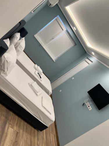מיטה או מיטות בחדר ב-Dani Apartment