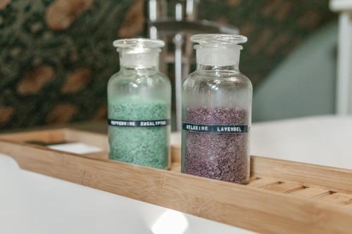 two glass bottles filled with different colored glitter at Logement Cornelia - Tholen, Zeeland in Tholen