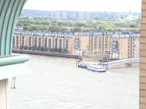 a view of a river from a window at Canary Wharf 1 bed apartment in London