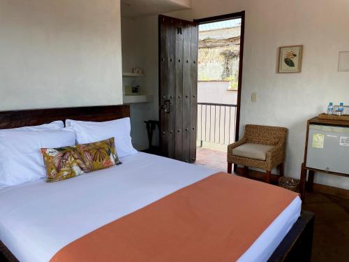 Postel nebo postele na pokoji v ubytování Hotel Boutique Posada Las Trampas