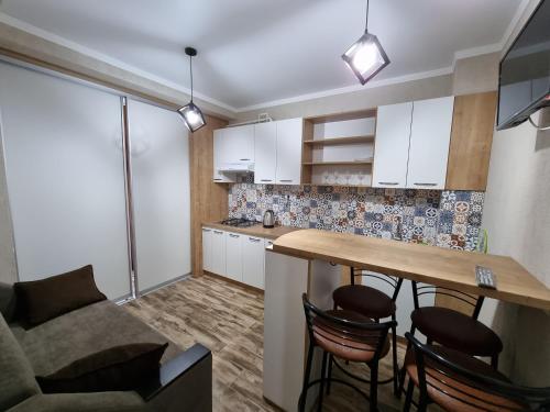 Virtuvė arba virtuvėlė apgyvendinimo įstaigoje New Luxury Apartments Cojocarilor street in Chisinau