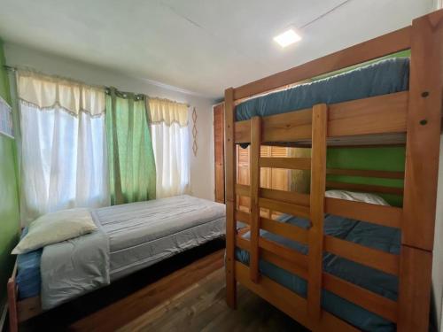 a bedroom with two bunk beds in it at Hostel 53 Sur in Puerto Natales