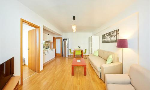 a living room with a couch and a table at Apartman Ortenova 74 in Kutná Hora