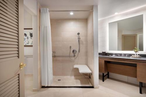 a bathroom with a shower and a sink at Fairmont Scottsdale Princess in Scottsdale