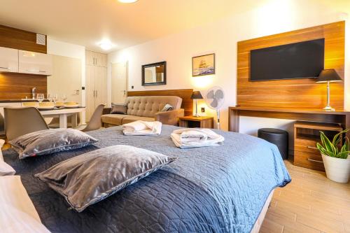 a bedroom with a bed with two pillows on it at Villa Magnolia in Świnoujście