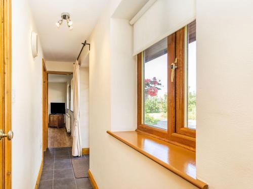 a hallway with a window in a house at Wild Duck Lodge in Rufford