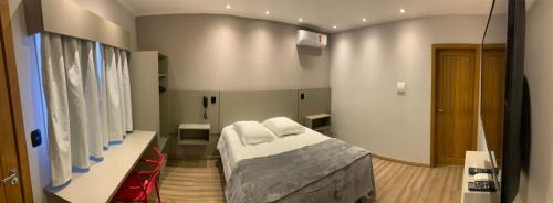 Ένα ή περισσότερα κρεβάτια σε δωμάτιο στο Hotel Villa Inácia