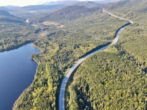 an aerial view of a river and a road at Bonne Bay Cottages in Bonne Bay Pond
