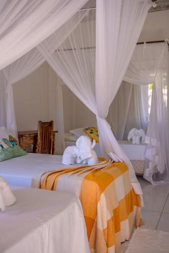 Katil atau katil-katil dalam bilik di Pousada Recanto Trancoso