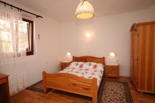 a bedroom with a bed and a window at Apartments with a parking space Podaca, Makarska - 6798 in Podaca