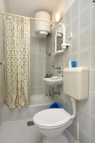 a bathroom with a toilet and a sink at Rooms by the sea Podaca, Makarska - 6824 in Podaca