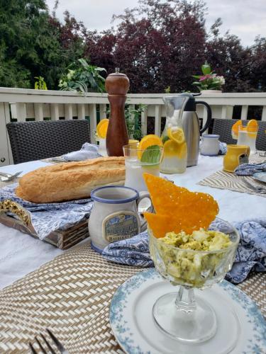a table with a glass bowl of food on it at Bayberry Inn B&B and Oregon Wellness Retreat in Ashland