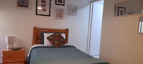 a bedroom with a bed with a pillow on it at Hospedaje de Lidia in Lima