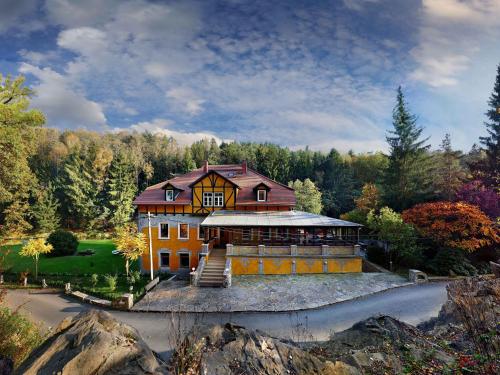 a large house is sitting on the side of a road at Elegance in Rotschönberg in Großschirma