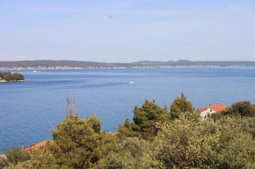 a large body of water with a boat in it at Apartments by the sea Kali, Ugljan - 8202 in Kali