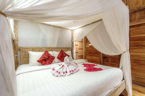 Tempat tidur dalam kamar di My Dream Bali