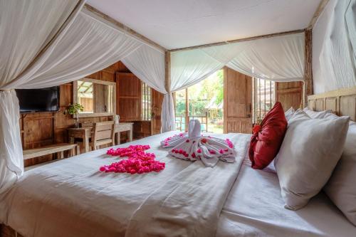 Tempat tidur dalam kamar di My Dream Bali