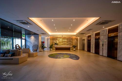 a lobby with a couch and a table in a building at The Song Luxury Condotel Vung Tau - Căn hộ cao cấp Luca's House in Vung Tau