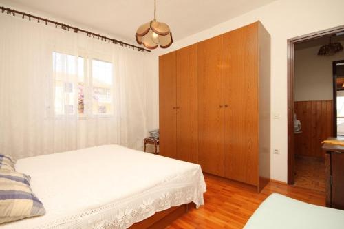 Posteľ alebo postele v izbe v ubytovaní Apartment Sali 8174a