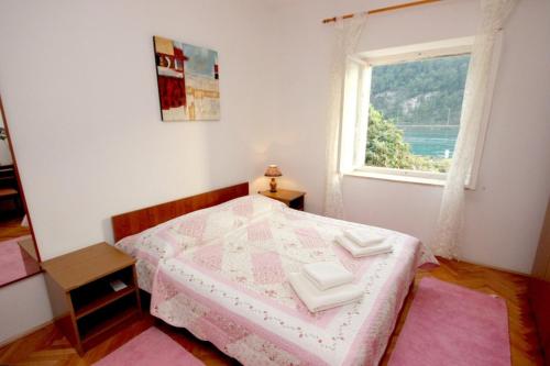 Ένα ή περισσότερα κρεβάτια σε δωμάτιο στο Seaside holiday house Mokosica, Dubrovnik - 8584