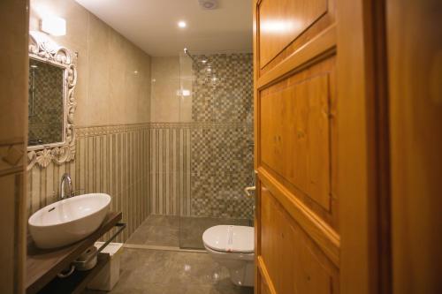 a bathroom with a sink and a toilet at Seaside house with a swimming pool Mokosica, Dubrovnik - 8583 in Mokošica