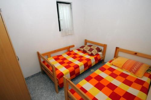 Katil atau katil-katil dalam bilik di Seaside secluded house with a swimming pool Cove Vitane, Pasman - 8481