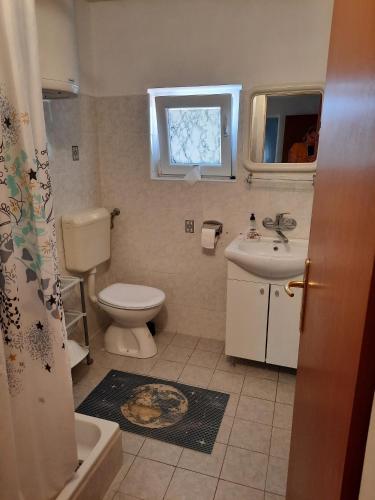 a bathroom with a toilet and a sink at Apartments and rooms with parking space Susica, Ugljan - 8265 in Ugljan
