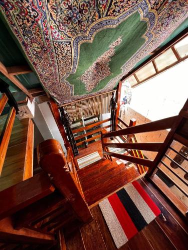 a view from the top of a boat with a colorful ceiling at Balay Paragua in El Nido