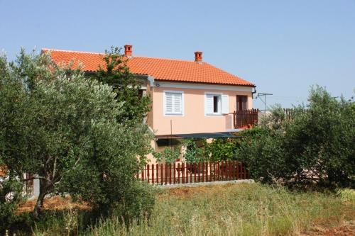 a house with a fence in front of it at Apartment Kraj 8288a in Kraj