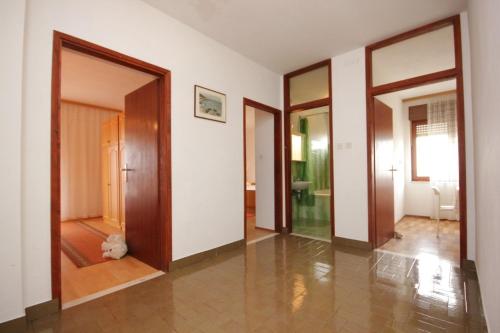 a hallway with three doors and a room with a hallway at Apartments by the sea Muline, Ugljan - 8520 in Donje Selo