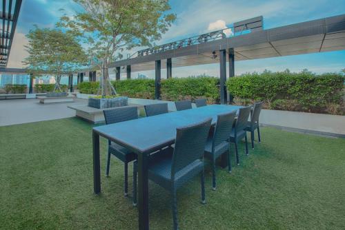 a blue table and chairs on a patio at GRANFERTE Phnom Penh Hotel in Phnom Penh