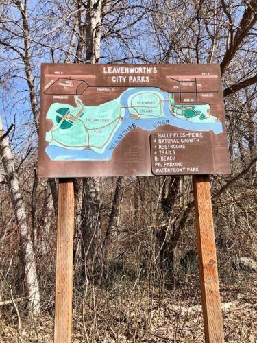 a sign for the leavenburgh city parks in the woods at Walk to Downtown Leavenworth * Sleeps 6 + Pets * Ground Level Gem! in Leavenworth