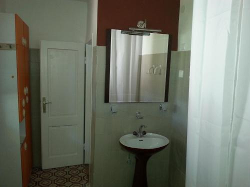 a bathroom with a sink and a mirror at Apartments with a parking space Biograd na Moru, Biograd - 11150 in Biograd na Moru