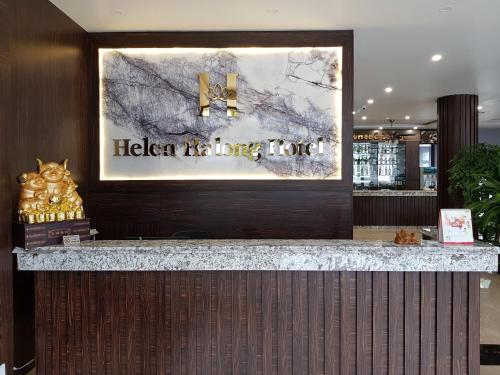 a sign for a kitchen waiting room in a building at Helen Halong Hotel in Ha Long