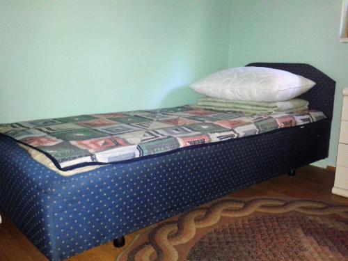 a small bed with a quilt on top of it at Apartments with a parking space Barbariga, Fazana - 11193 in Barbariga